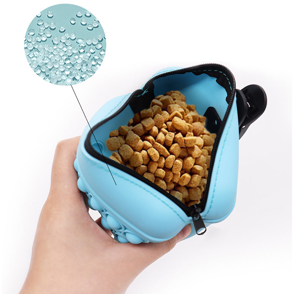WilderPaw TrailPouch treat pouch held in hand with training treats
