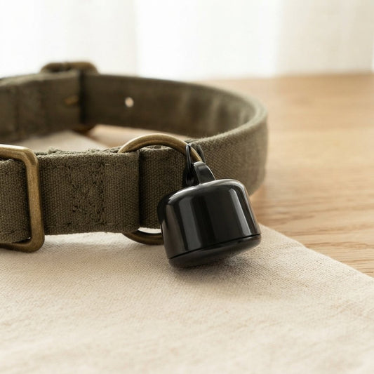 WilderPaw RoamTag attached to an earthy green dog collar